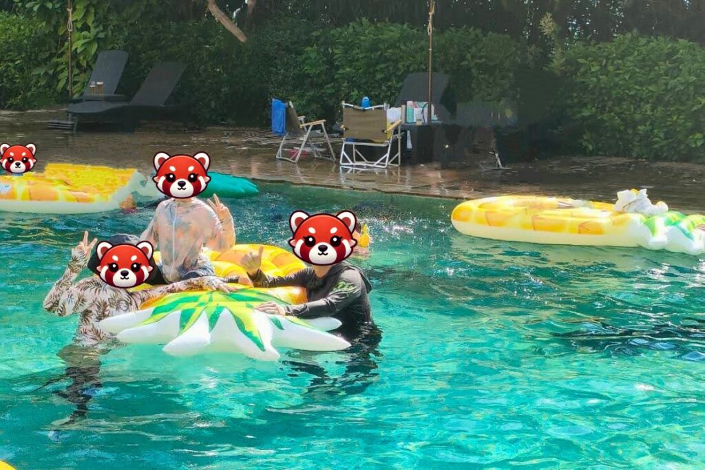 Family enjoying the pineapple-themed pool at Iriomote Hotel on Iriomote Island