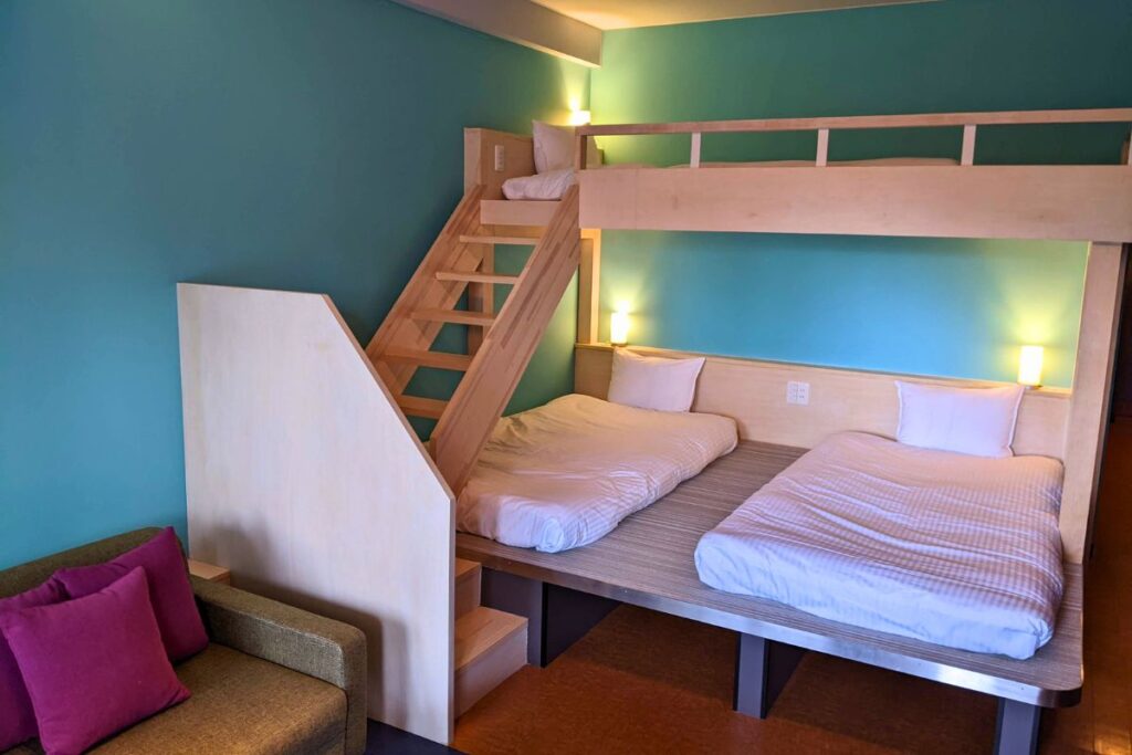 Loft-style family room with bunk beds at Iriomote Hotel on Iriomote Island