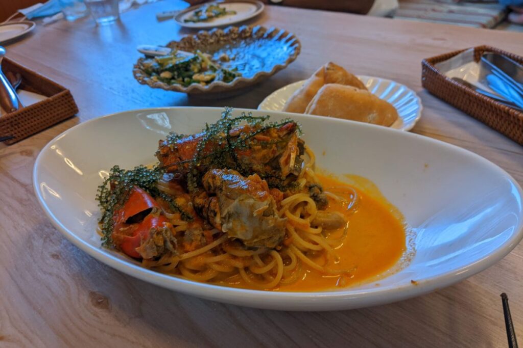 Crab tomato cream pasta served near Iriomote Hotel, a local food highlight on Iriomote Island