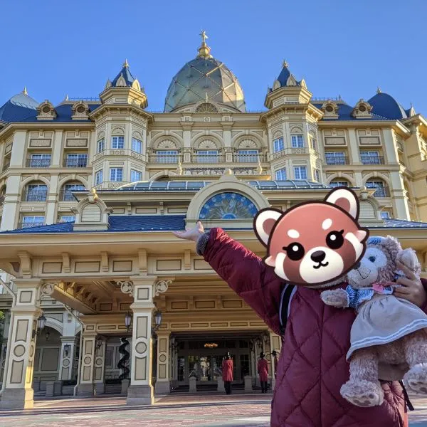 tokyo disneyland hotel entrance with guest posing in front