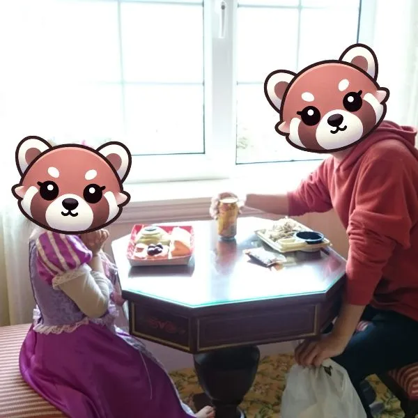 Family enjoying snacks by the window at tokyo disneyland hotel