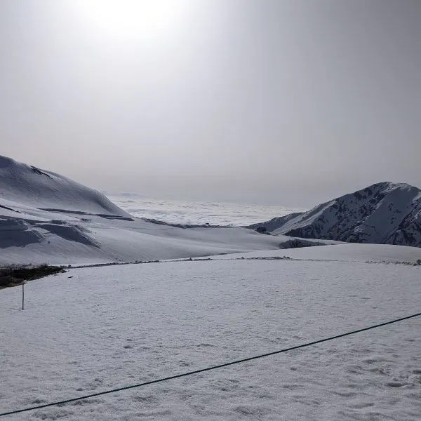 View of a dramatic sea of clouds above the snow-covered Tateyama mountain range in spring.