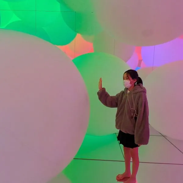 Interactive digital art at TeamLab Planets in Toyosu, a unique side trip within a family trip Tokyo Disney Resort.