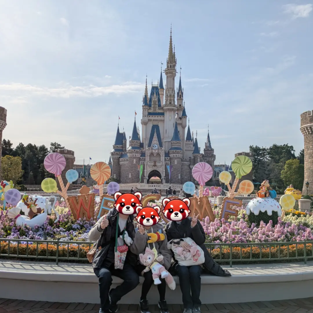 Tokyo Disneyland castle with family in front – Magical Japan travel spot for kids and parents