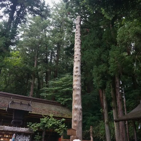 Onbashira sacred pillar — symbol of tradition at Suwa Taisha Shrine.