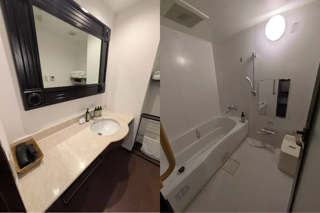 Spacious bathroom and vanity area in a family room at Iriomote Hotel – clean and well-equipped