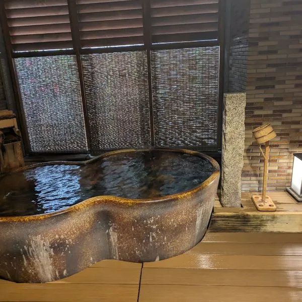 Ceramic private hot spring bath at Kyoritsu Resort – family travel Japan, onsen ryokan