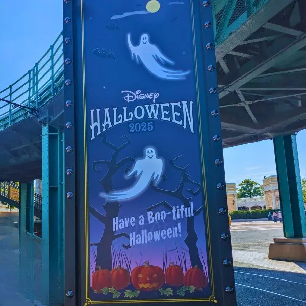 Tokyo Disney Halloween 2025 signboard with ghost illustrations and pumpkins, capturing the festive entrance vibe for the Tokyo Disney itinerary.